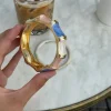 Ebony armbånd med striber - Blå/lyserød/hvid/guld